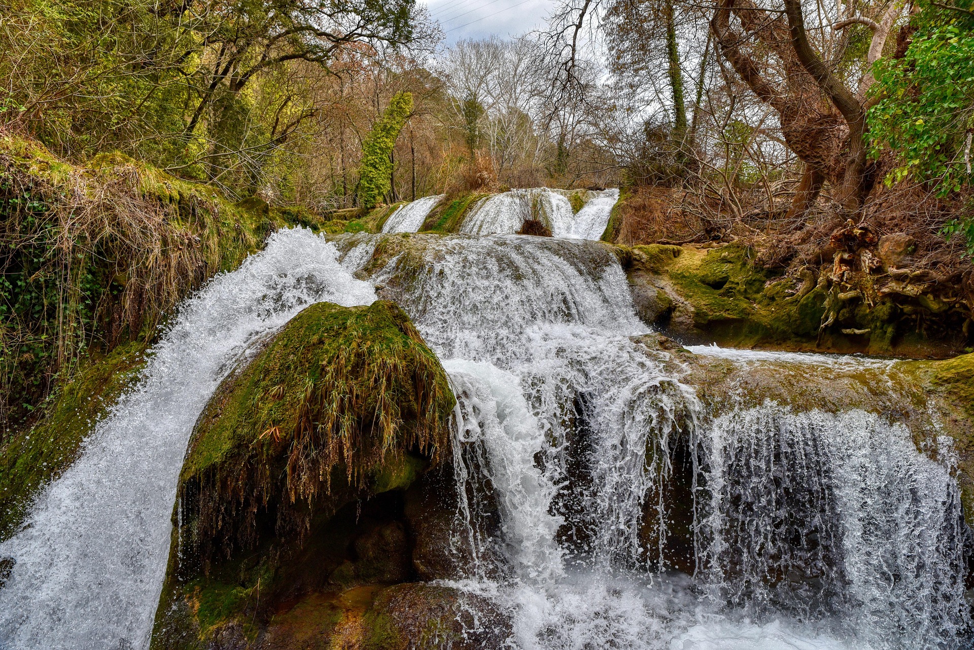 Watefall rushing over mossy rocks