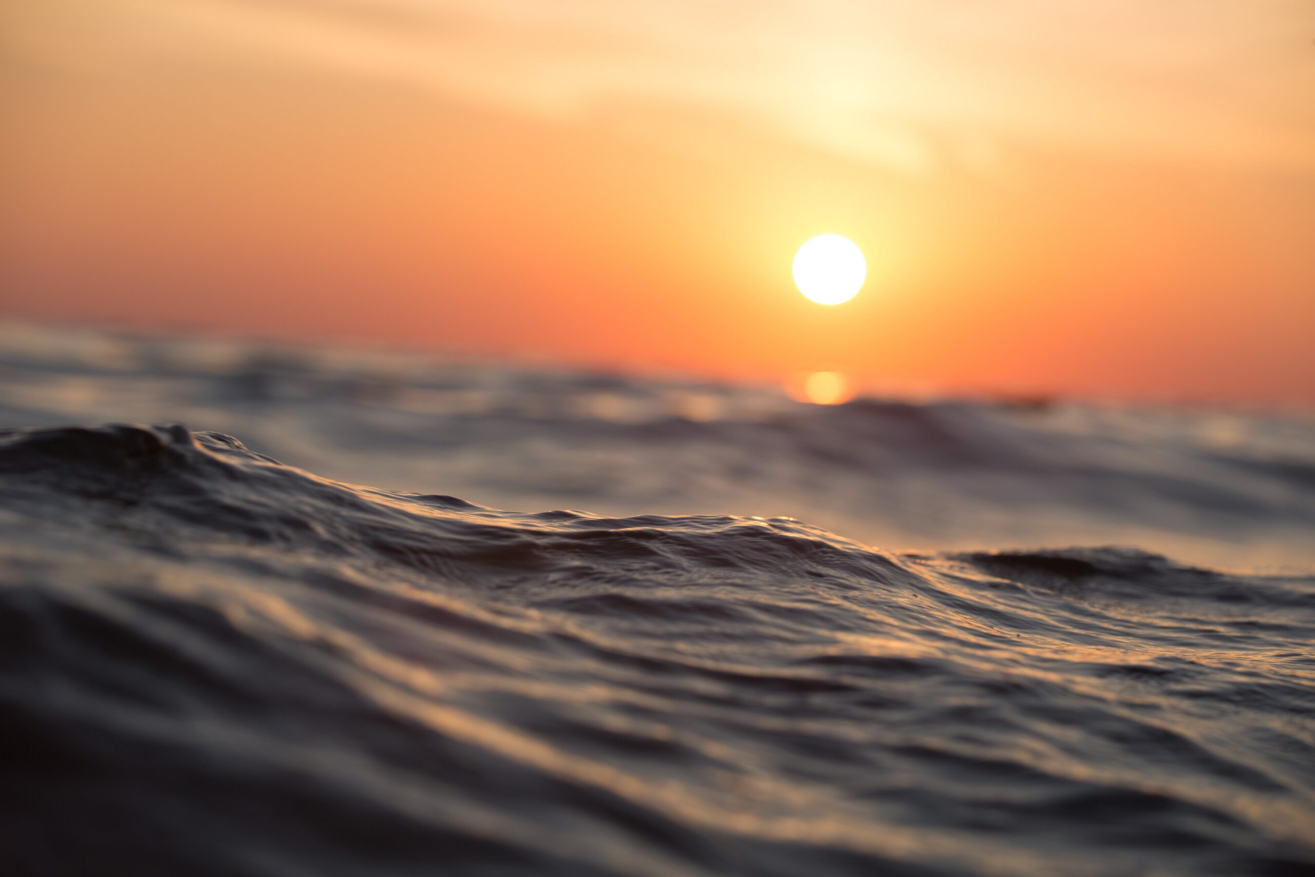 Sunset over ocean waves